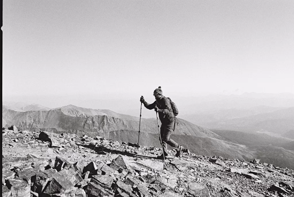 A hiker climbing up Quandary Peak.