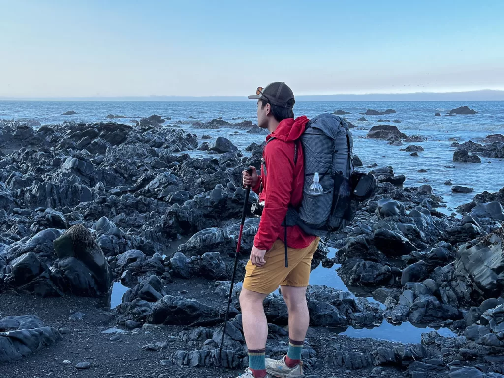 A hiker walking along the beach on the Lost Coast Trail.