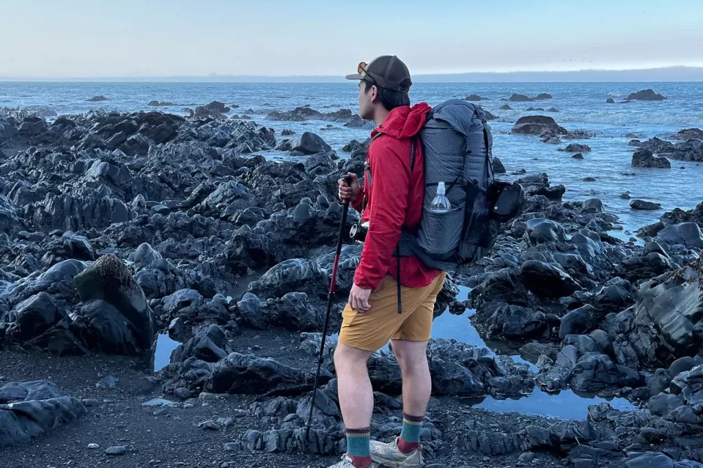 A hiker backpacking for the first time along the beach on the Lost Coast Trail.