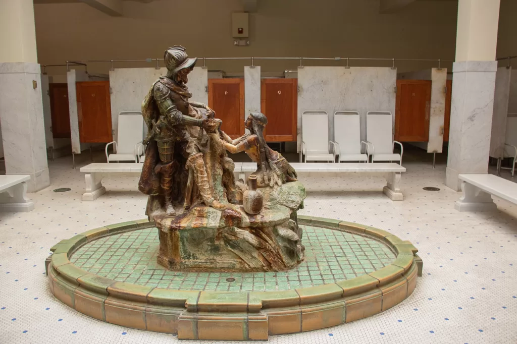 A sculpture of Spanish explorer Hernando de Soto and a Native American woman inside the Fordyce Bathhouse.