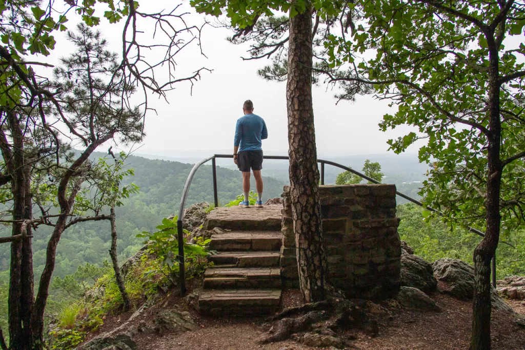 A hiker enjoying a lookout along the Goat Rock Trail. 