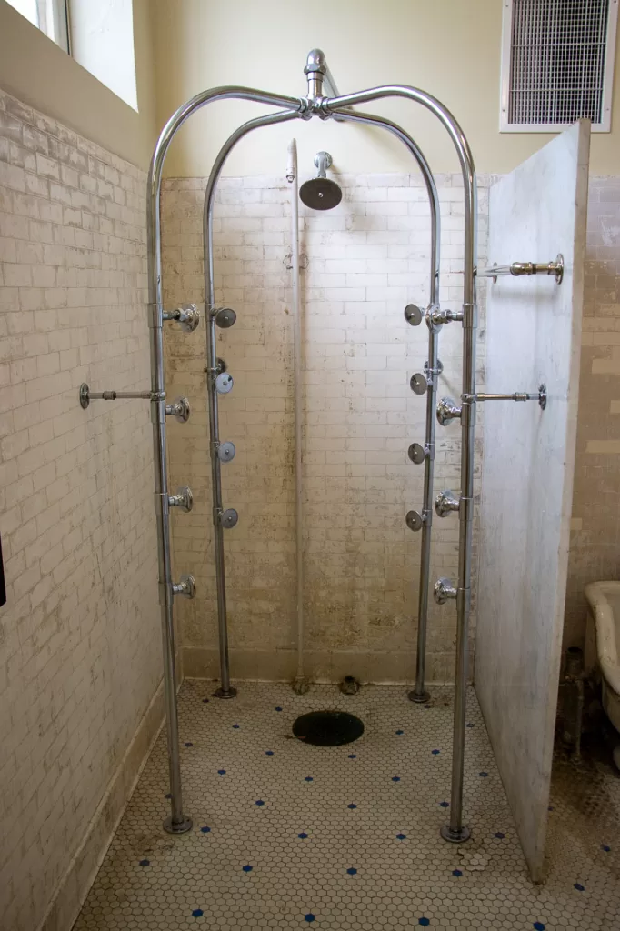 A 17-head shower at Fordyce Bathhouse that you can visit at Hot Springs National Park. 