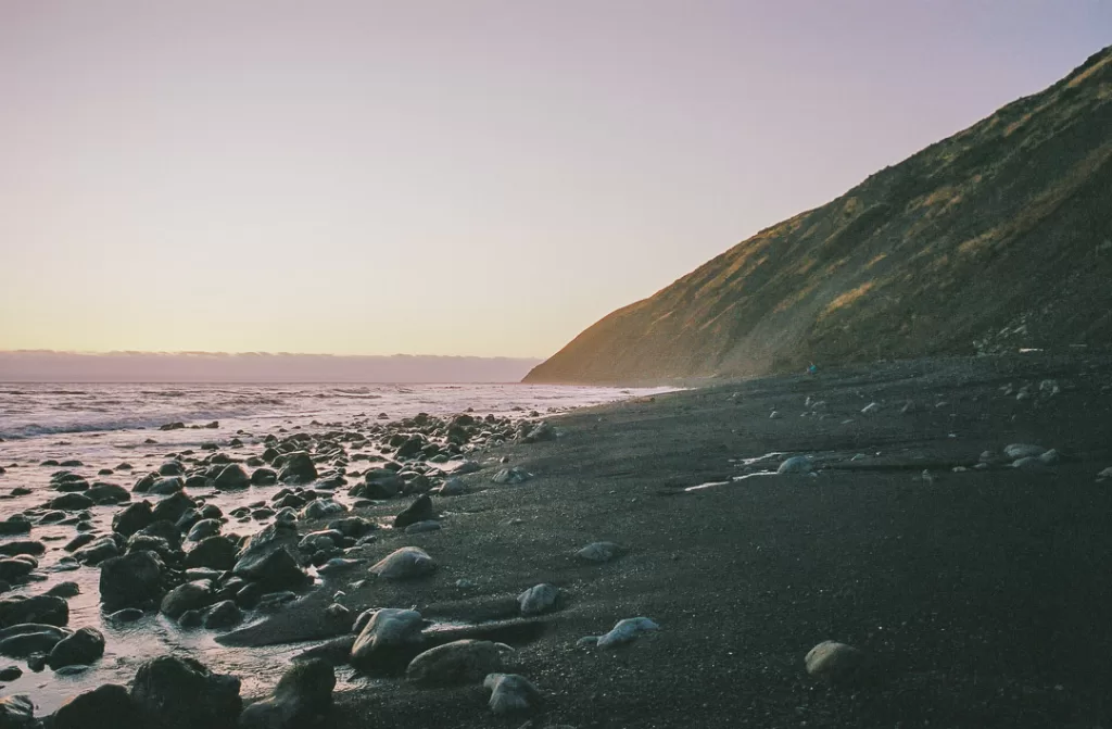 The sun setting on the beach. 