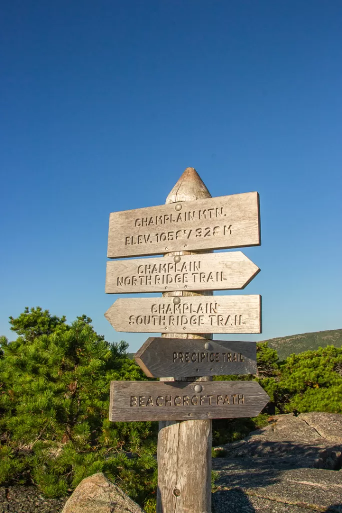 a trail marker on the top of Champlain Mountain. 