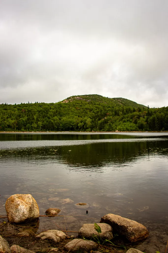 A mountain reflecting off of a lake.