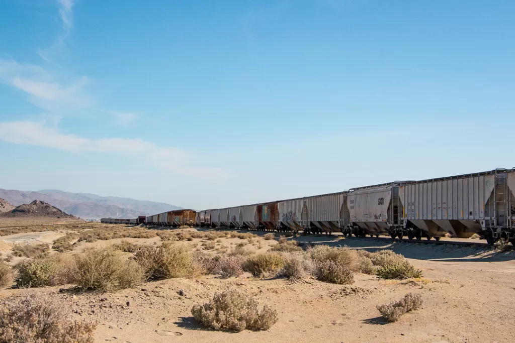 Train cars in the desert.