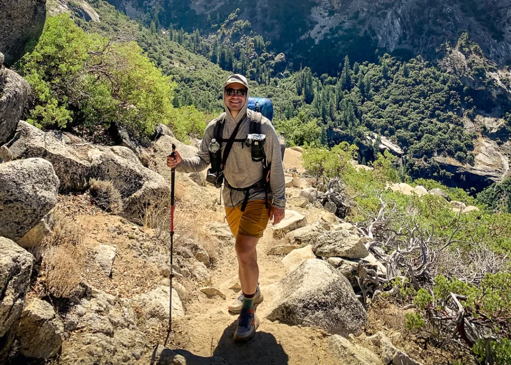 A backpacker hiking through Yosemite National Park. 