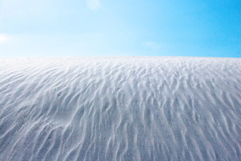 white gypsum sand sparkling in the sunlight. 