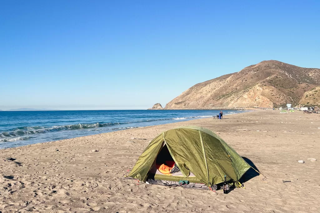 A tent set up on the beach at Thornhill Broome Campground, a camping destination close to Los Angeles. 