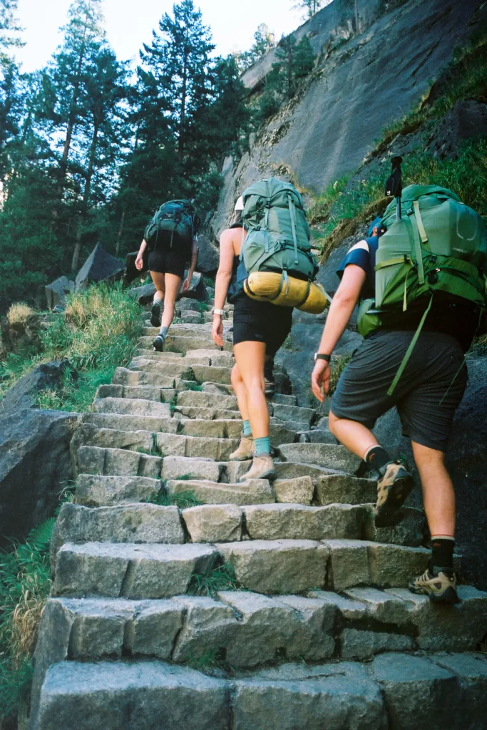 Hikers climbing up the Mist Trail.