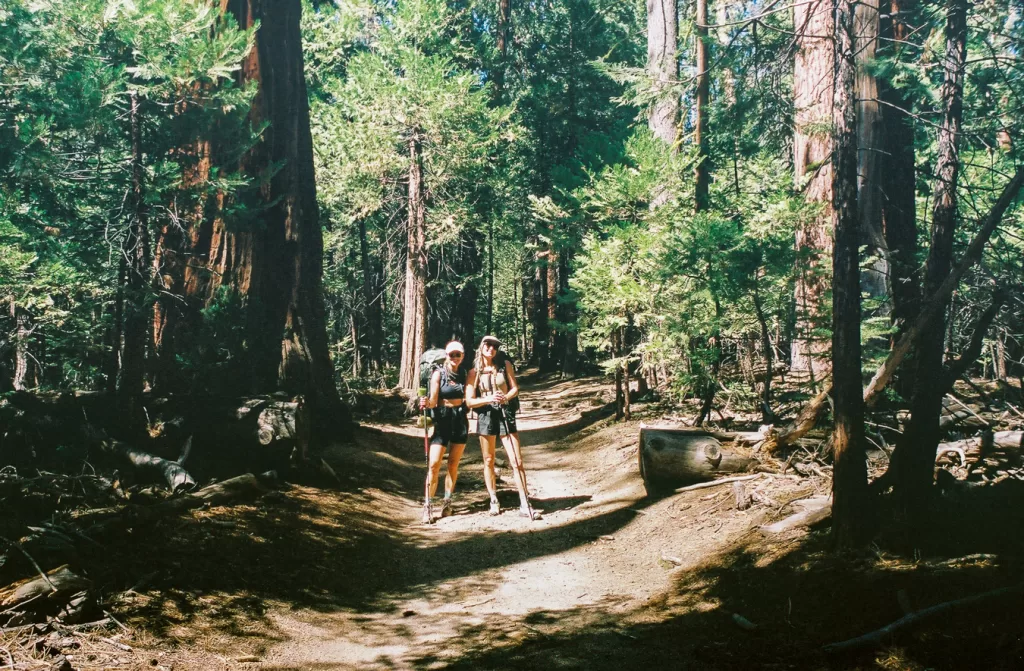 Two hikers posing for a picture in little Yosemite Valley.