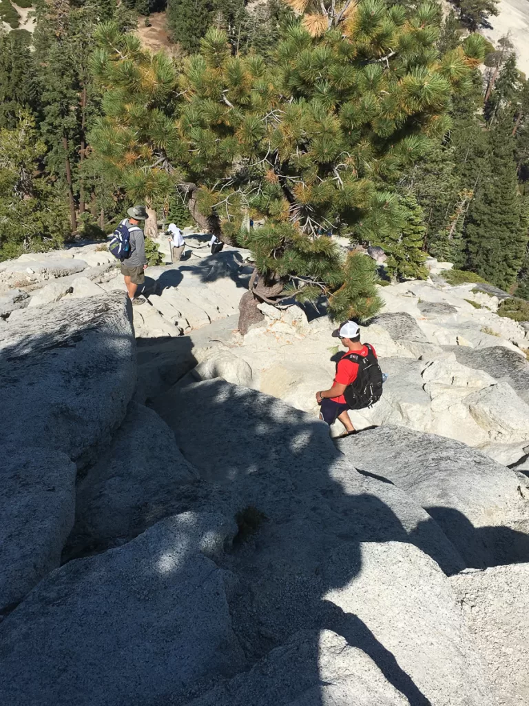 Two hikers hiking sub dome.